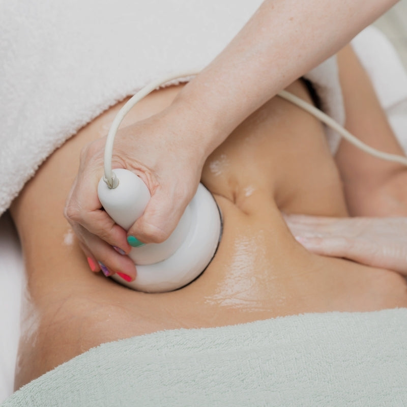 Person using ultrasound cavitation in clinic
